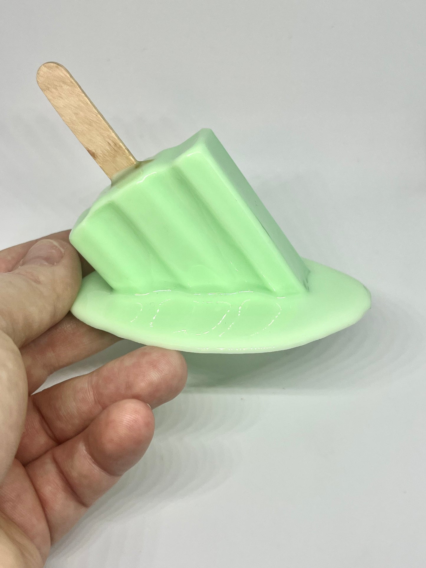 Green melting popsicle resin sculpture