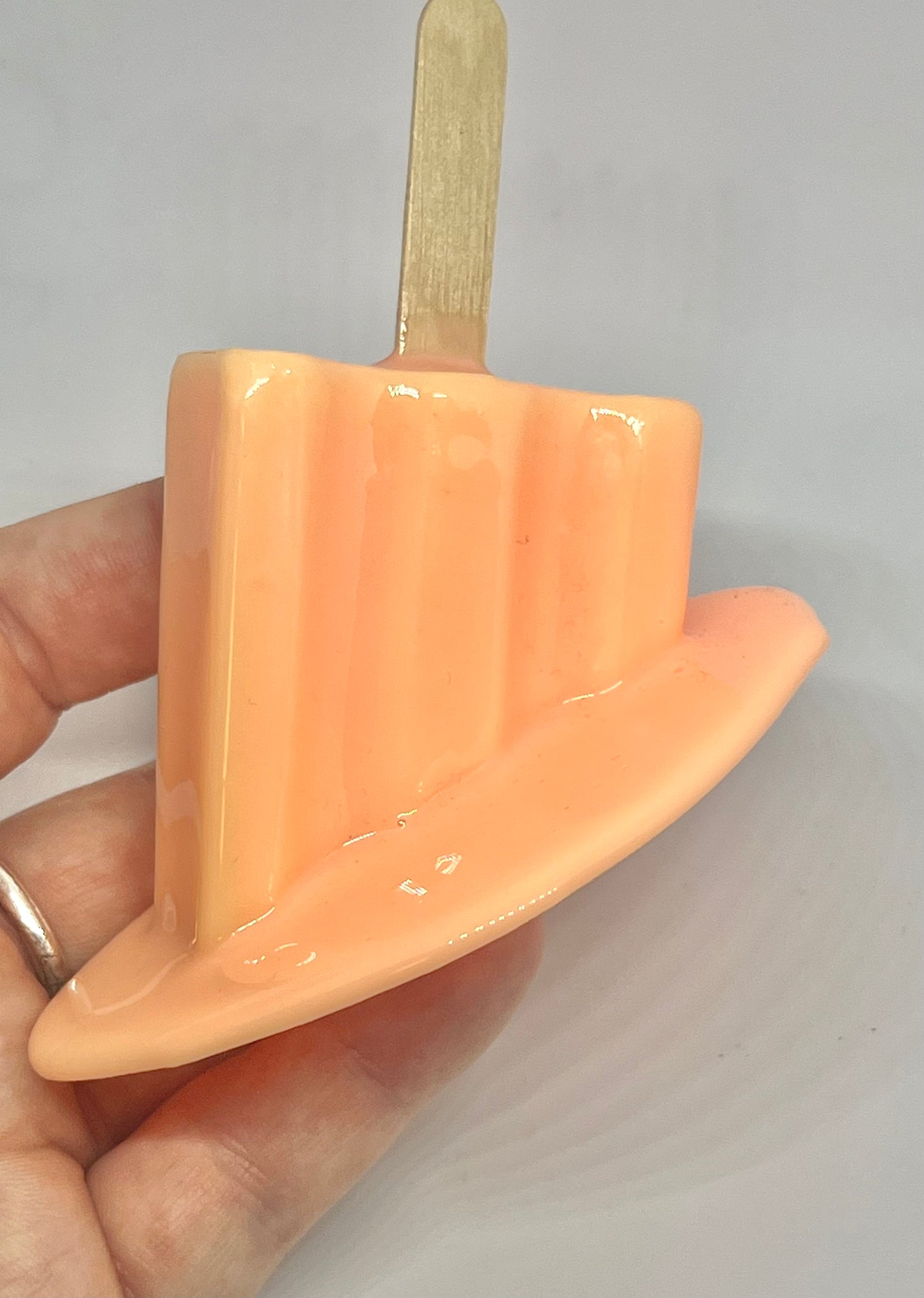 Orange melting popsicle resin sculpture