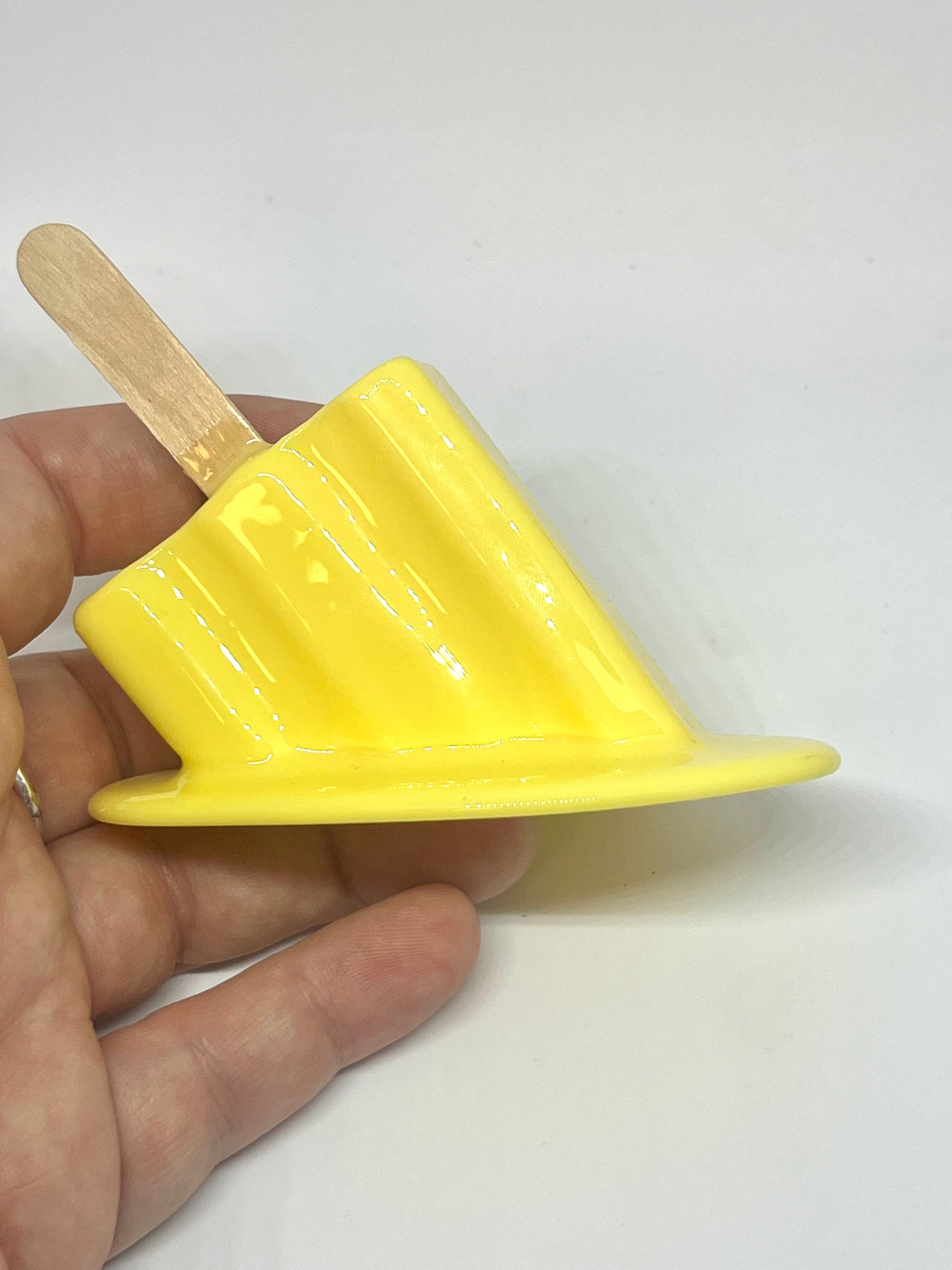 Yellow melting popsicle resin sculpture