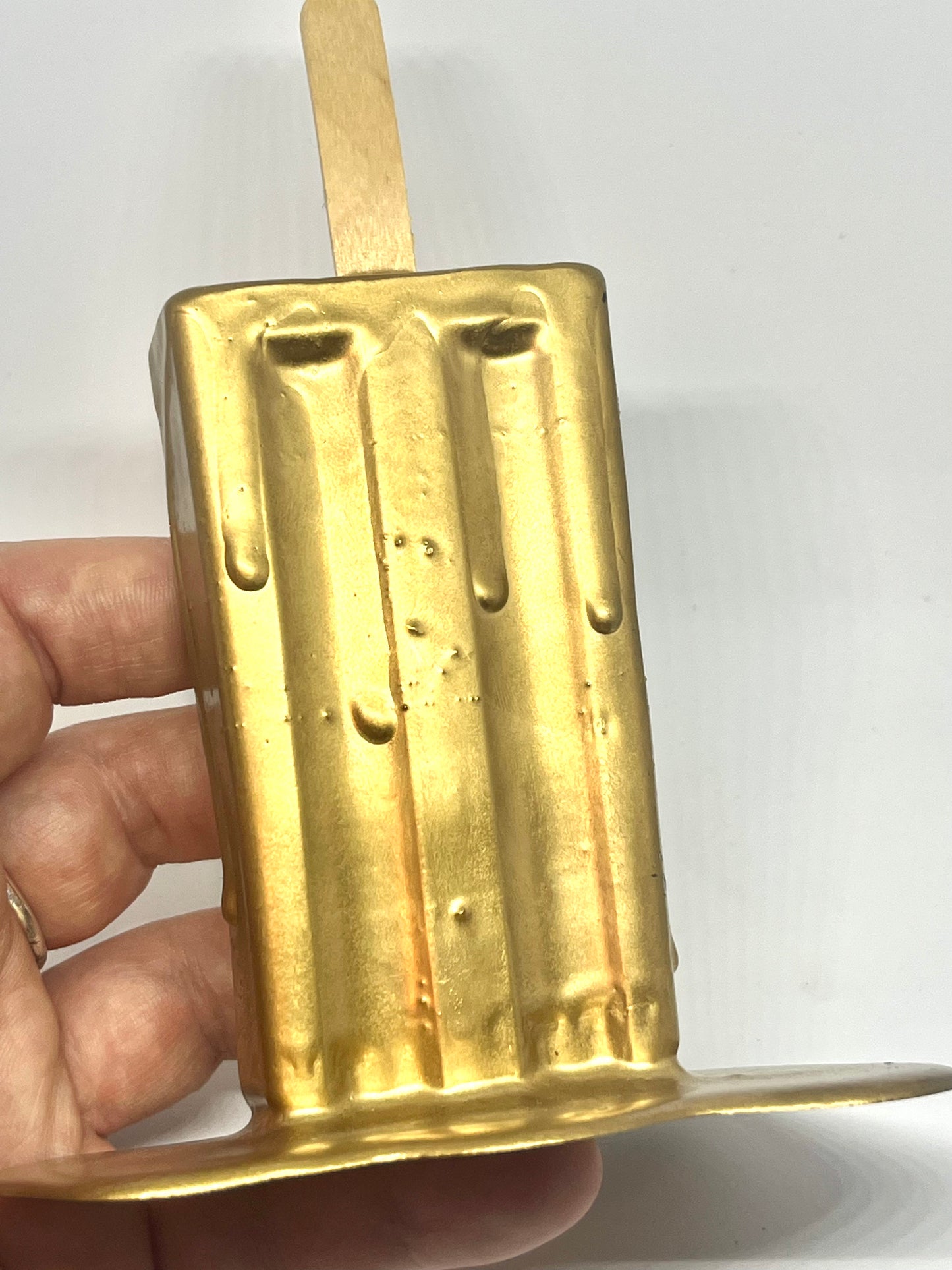 Gold melting popsicle resin sculpture