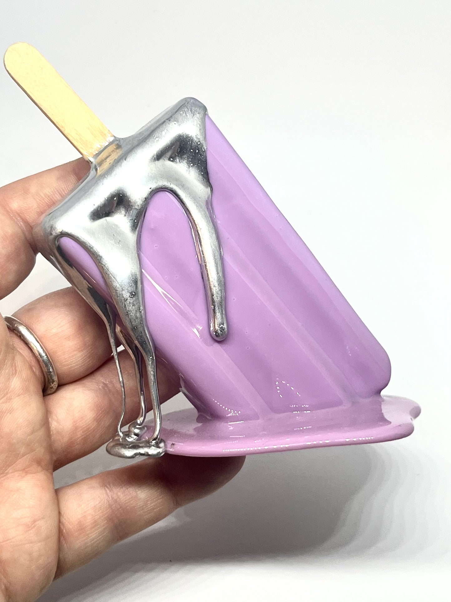 Purple melting popsicle resin sculpture with chrome details