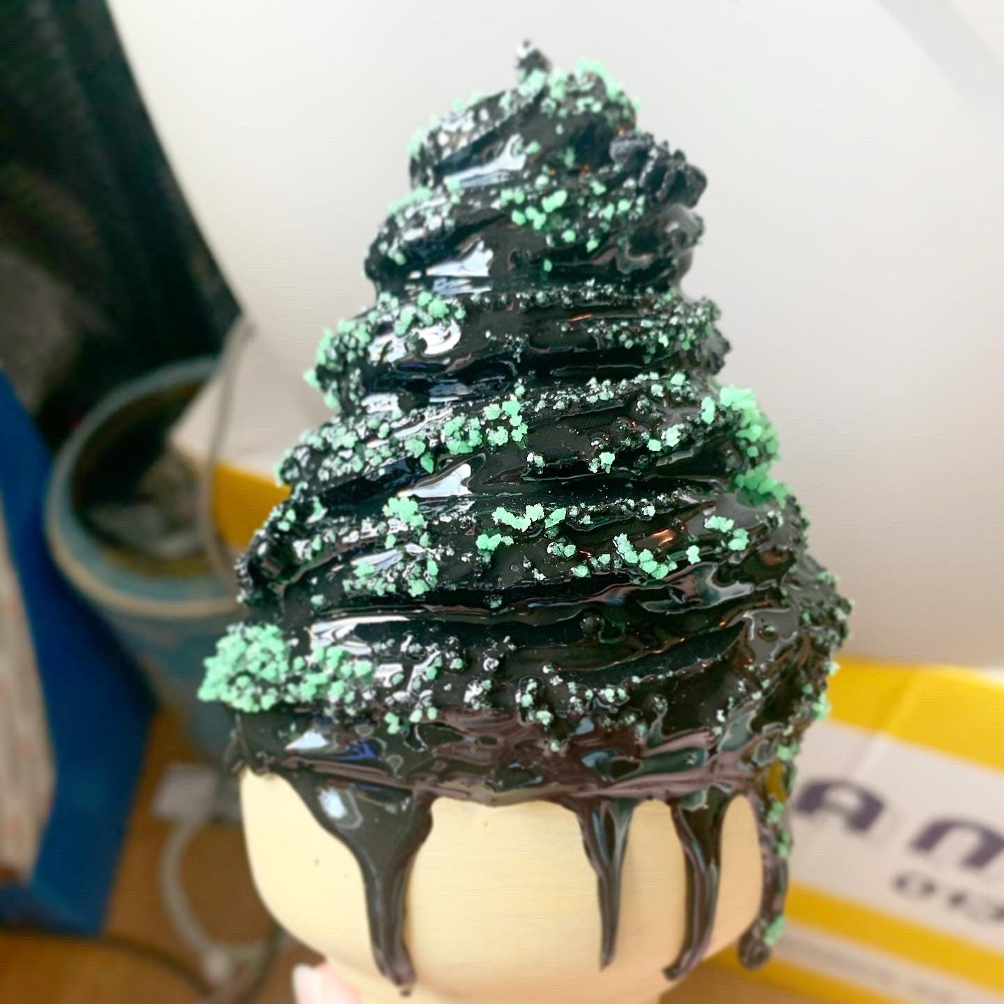 Black Melting Ice Cream Cone With Green Glow In The Dark Sprinkles And Black Spiders