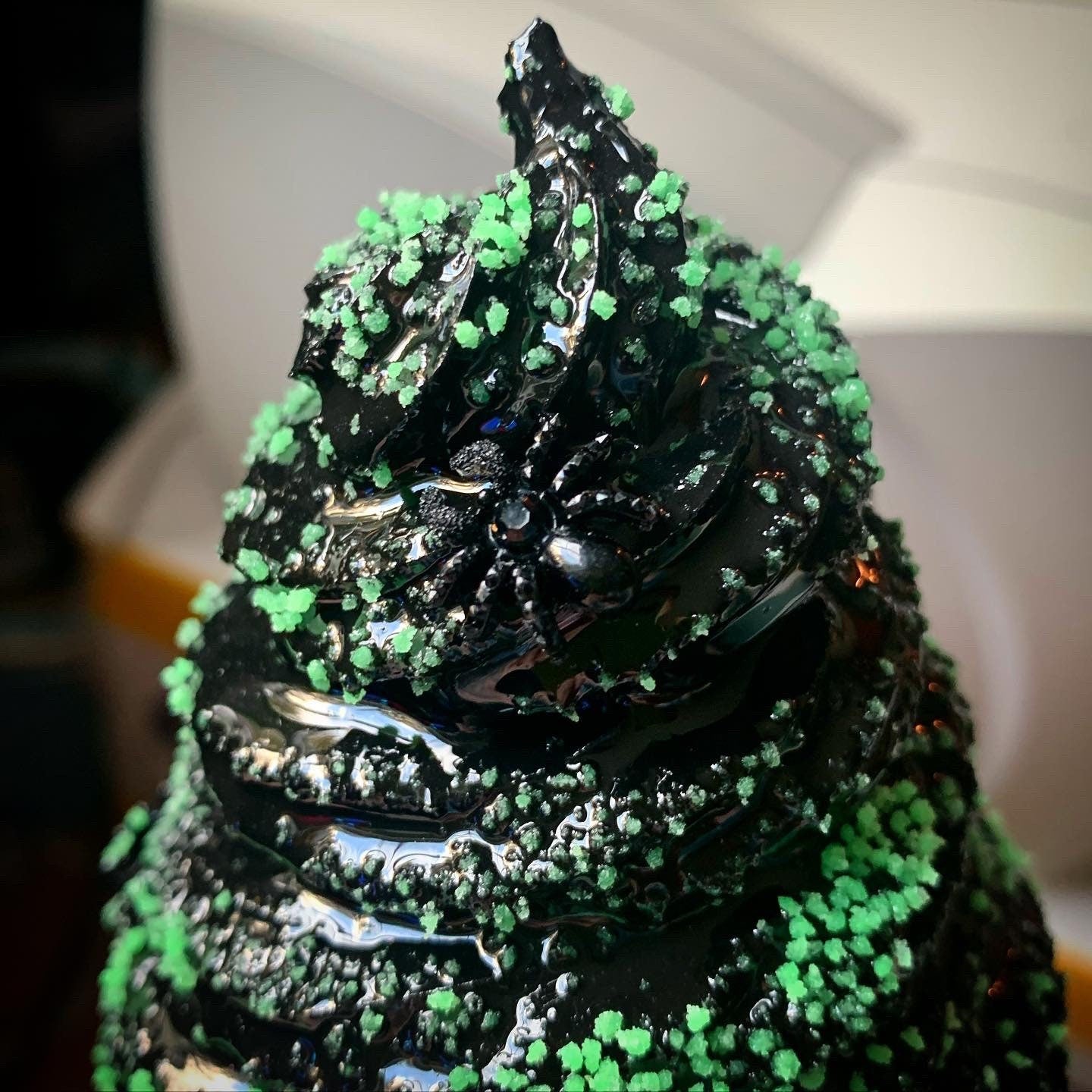 Black Melting Ice Cream Cone With Green Glow In The Dark Sprinkles And Black Spiders
