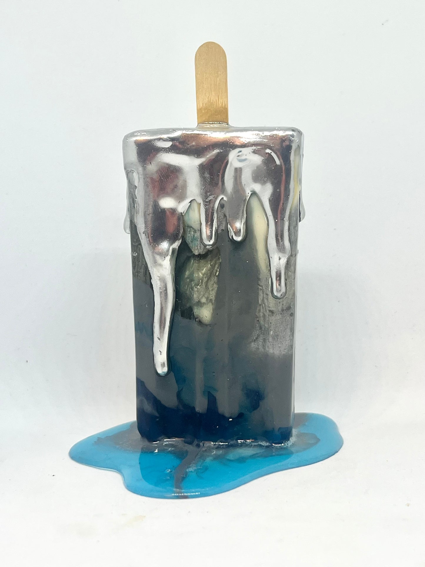 Melting popsicle resin sculpture with chrome topping