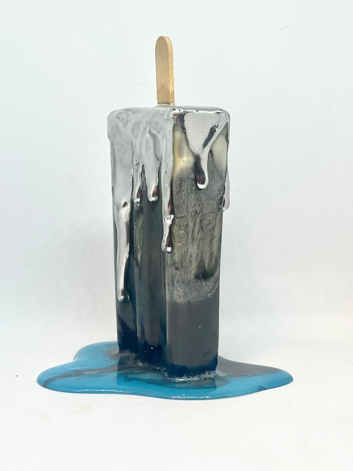 Melting popsicle resin sculpture with chrome topping