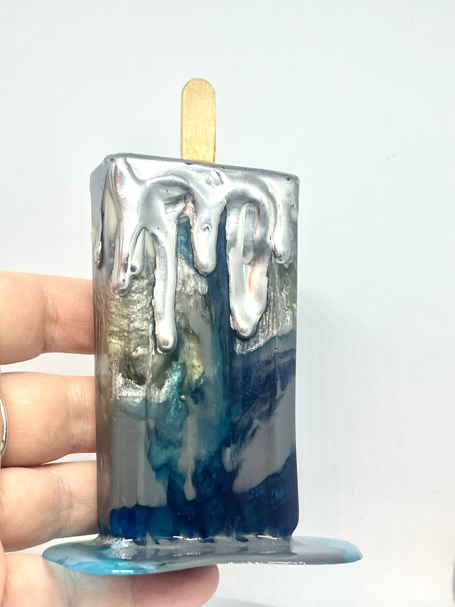 Melting popsicle resin sculpture with chrome topping