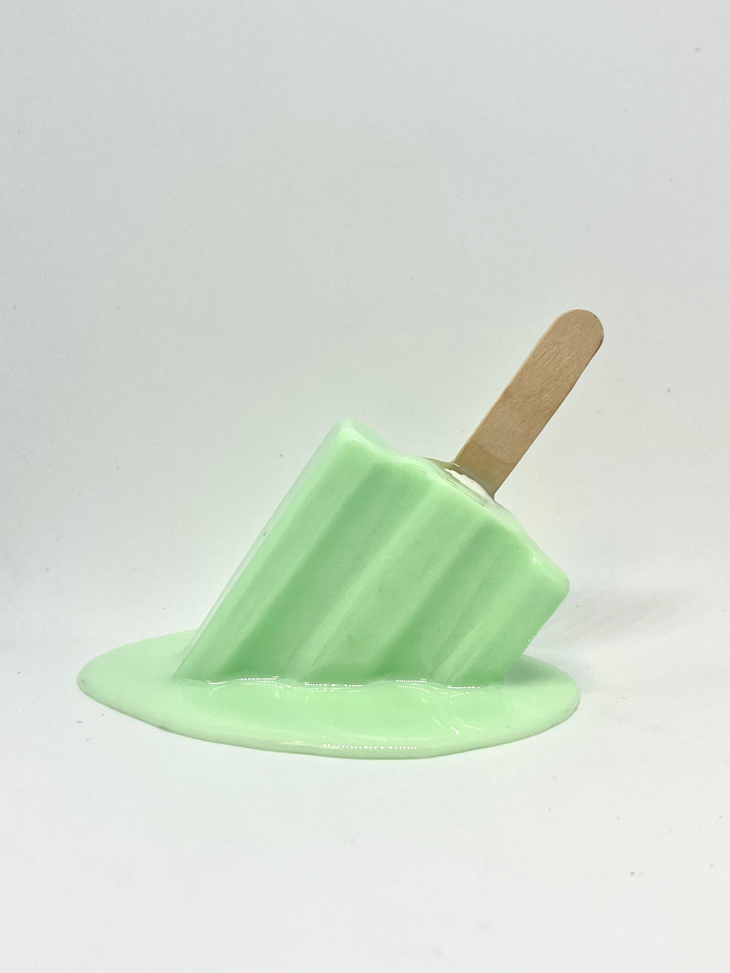 Green melting popsicle resin sculpture