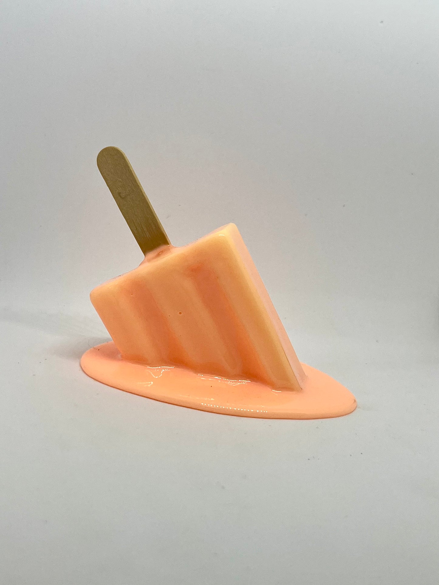 Orange melting popsicle resin sculpture