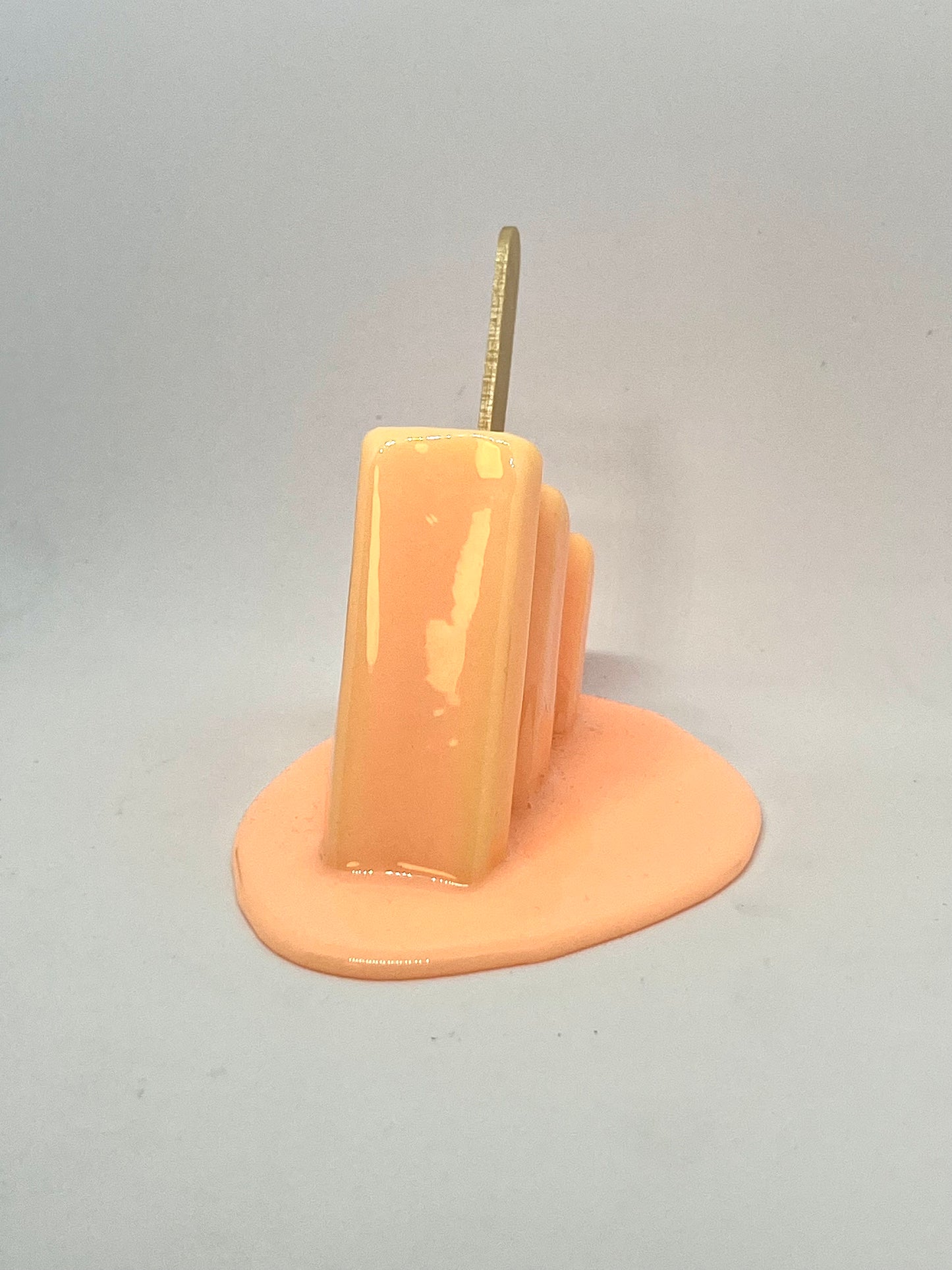 Orange melting popsicle resin sculpture