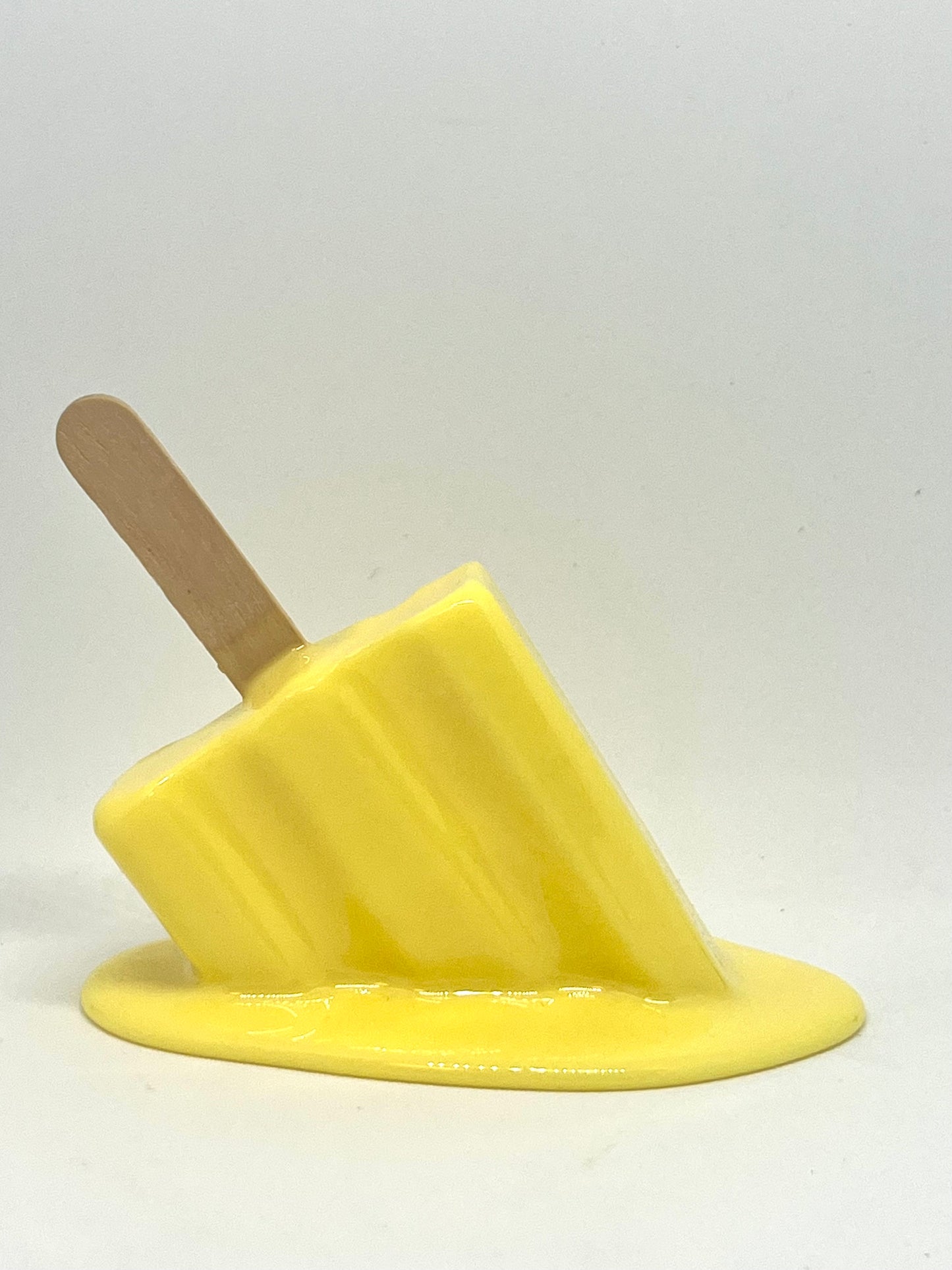 Yellow melting popsicle resin sculpture