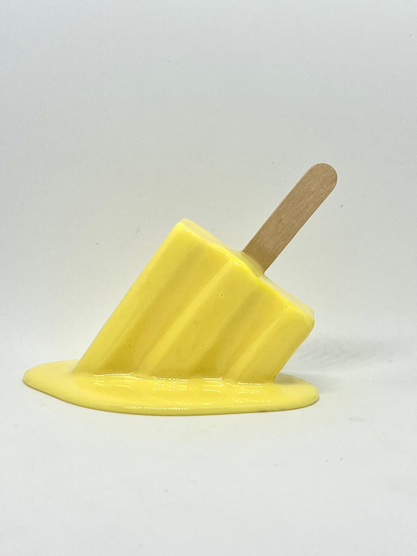Yellow melting popsicle resin sculpture
