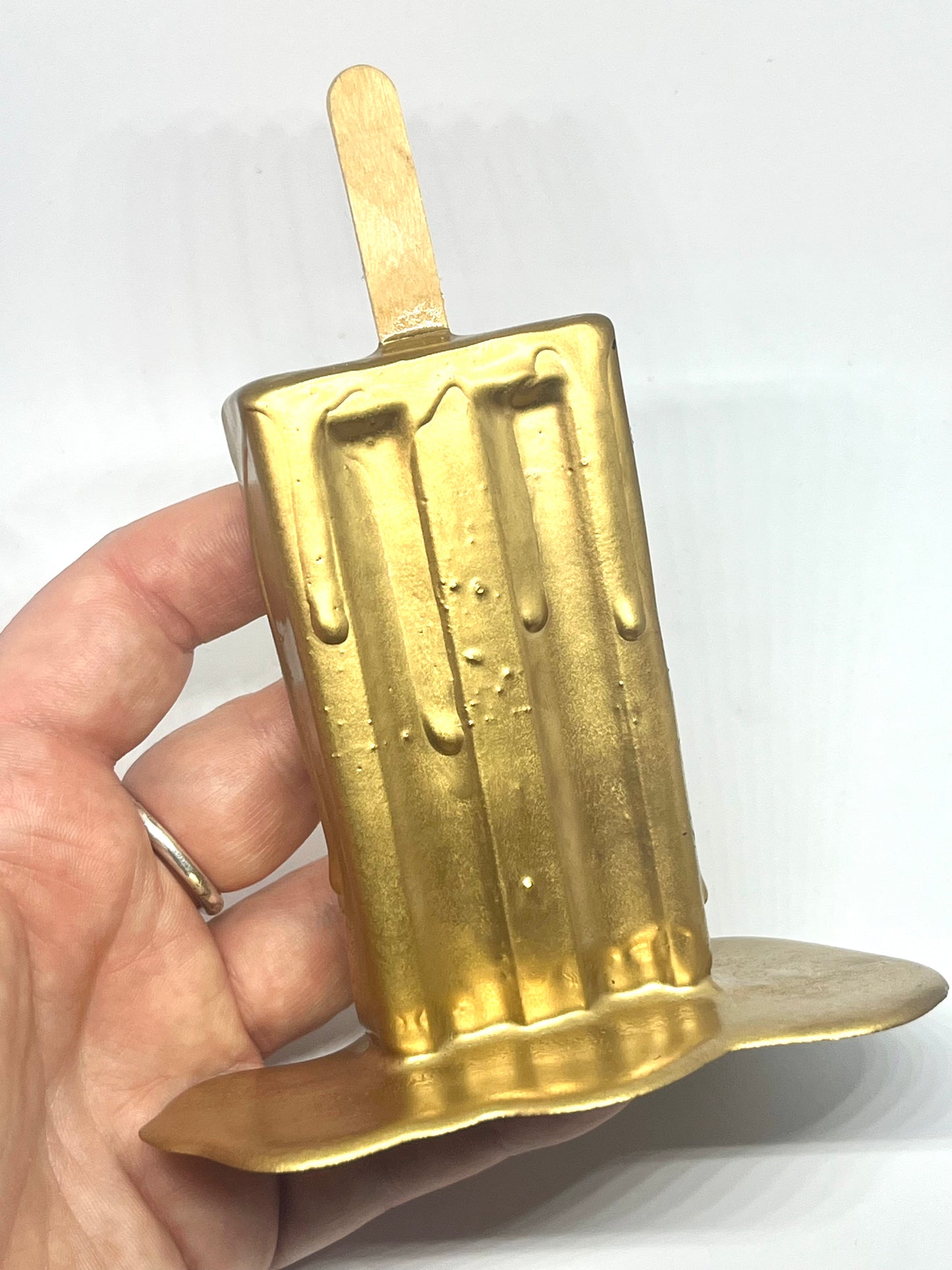 Gold melting popsicle resin sculpture