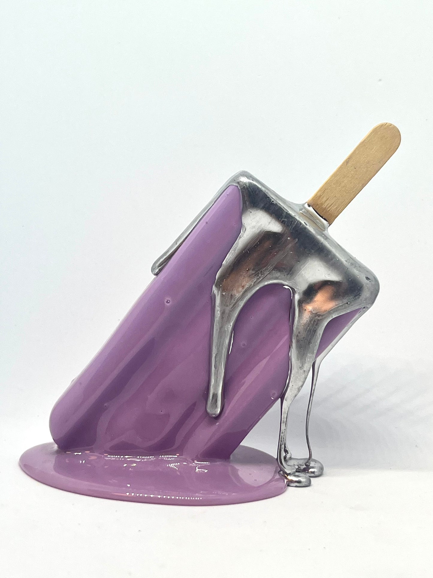 Purple melting popsicle resin sculpture with chrome details