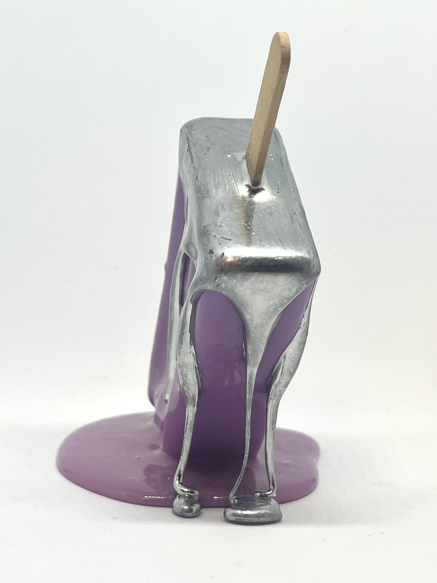 Purple melting popsicle resin sculpture with chrome details