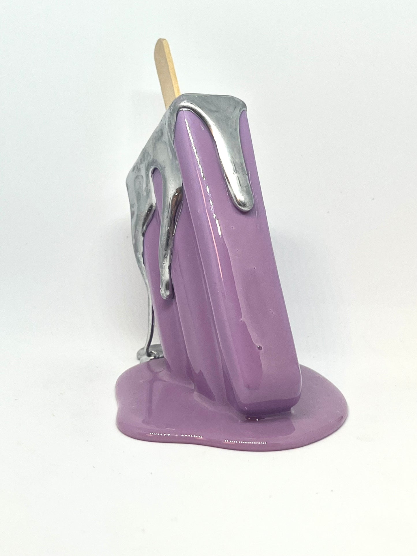 Purple melting popsicle resin sculpture with chrome details