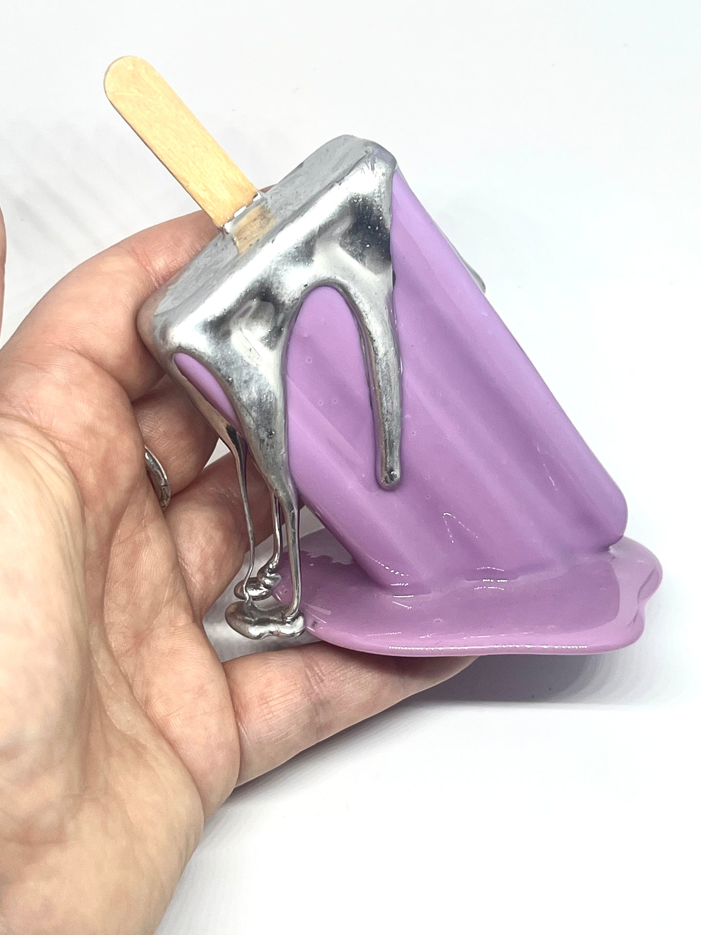 Purple melting popsicle resin sculpture with chrome details
