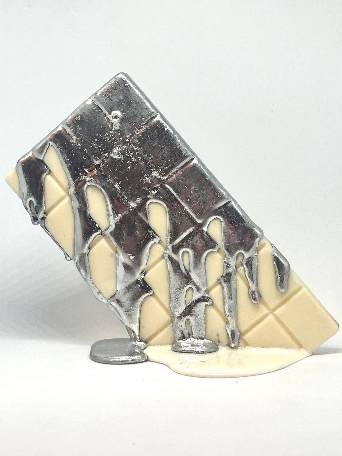 White melting chocolate bar resin sculpture with silver topping