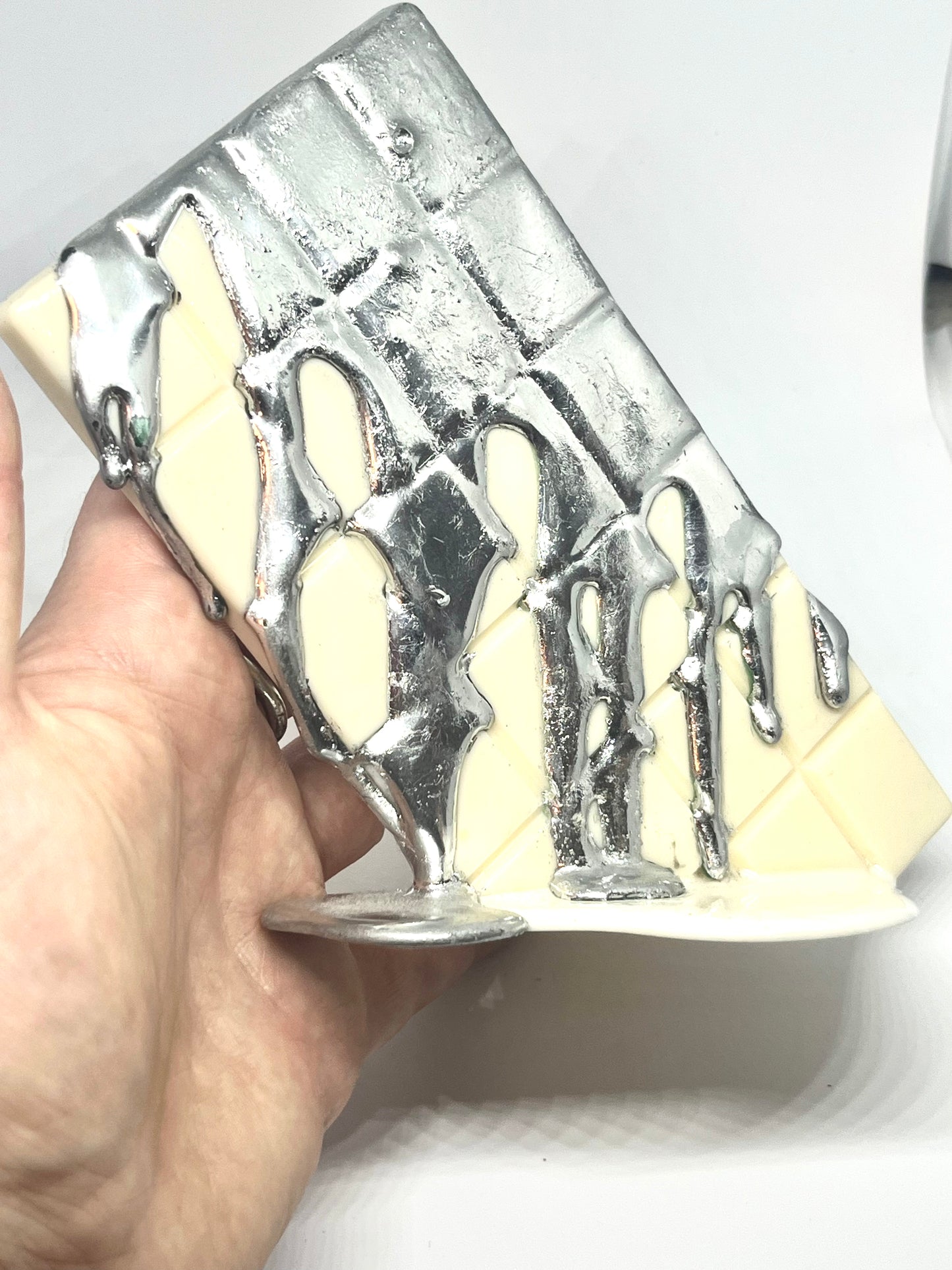 White melting chocolate bar resin sculpture with silver topping