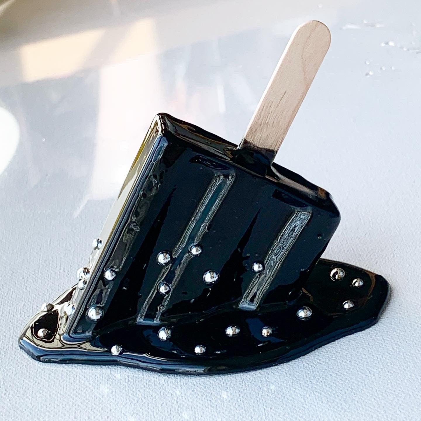Black Sprinkled Melting Popsicle Resin Sculpture