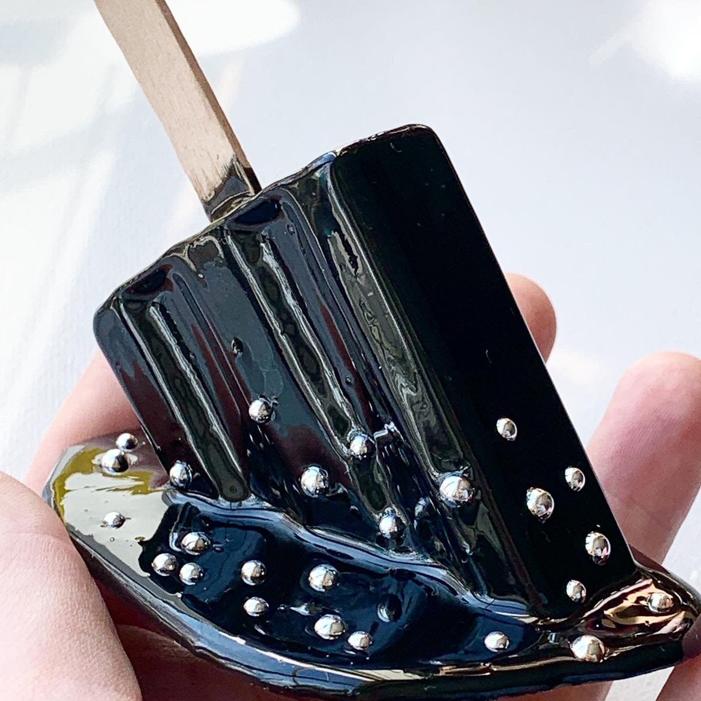 Black Sprinkled Melting Popsicle Resin Sculpture